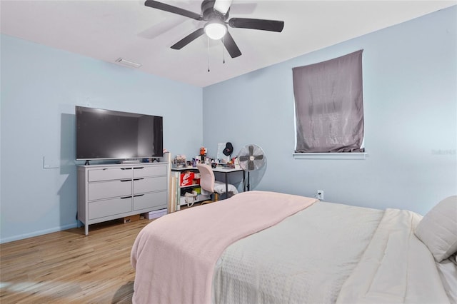 bedroom featuring ceiling fan and light hardwood / wood-style flooring