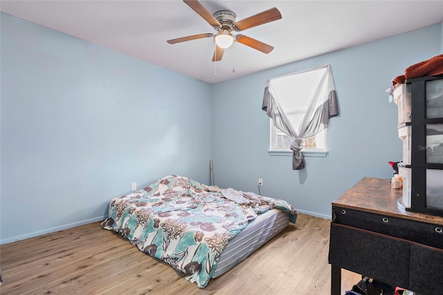 bedroom featuring ceiling fan and light hardwood / wood-style flooring