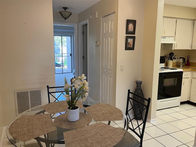 dining room featuring light tile patterned flooring