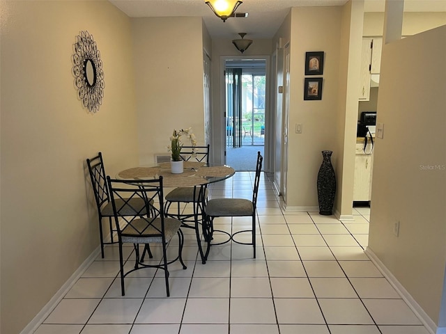 dining space with light tile patterned floors