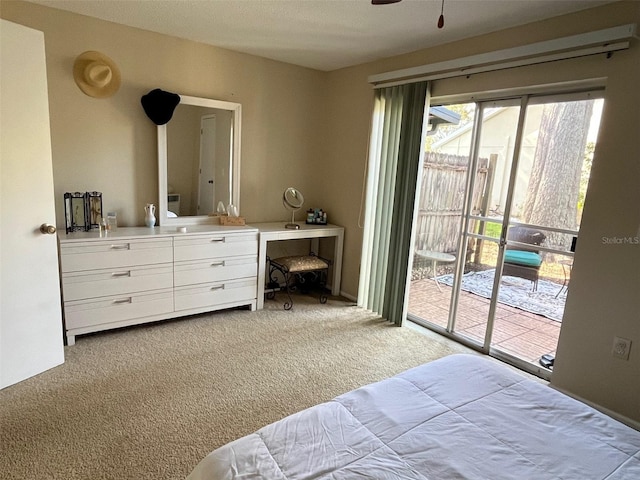 carpeted bedroom featuring access to outside