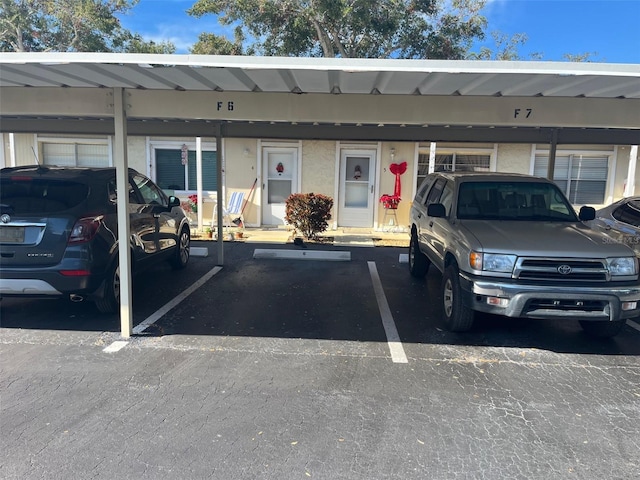 view of vehicle parking featuring a carport