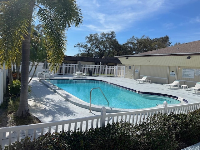 pool featuring a patio and fence