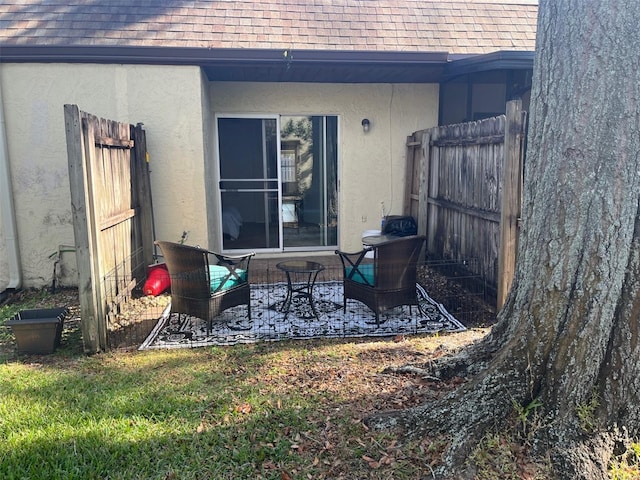 view of patio featuring fence