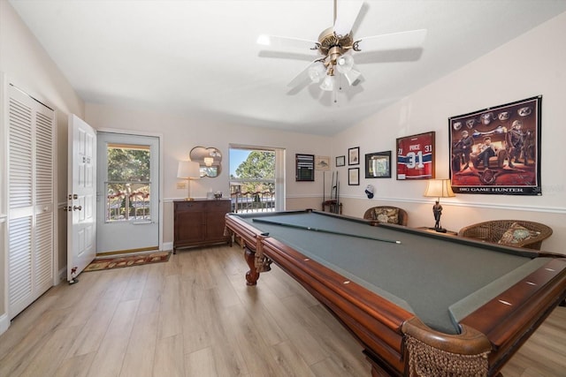 playroom with ceiling fan, light hardwood / wood-style floors, vaulted ceiling, and pool table