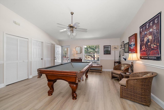 playroom with light hardwood / wood-style flooring, ceiling fan, lofted ceiling, and pool table