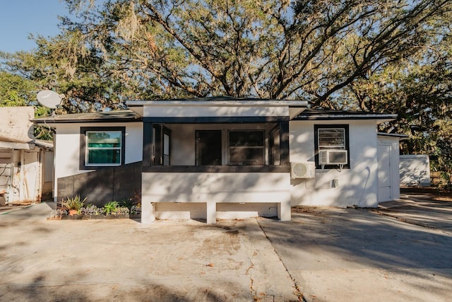 view of front of property featuring cooling unit