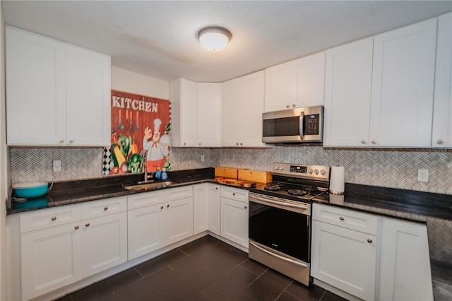 kitchen with white cabinetry, sink, and appliances with stainless steel finishes