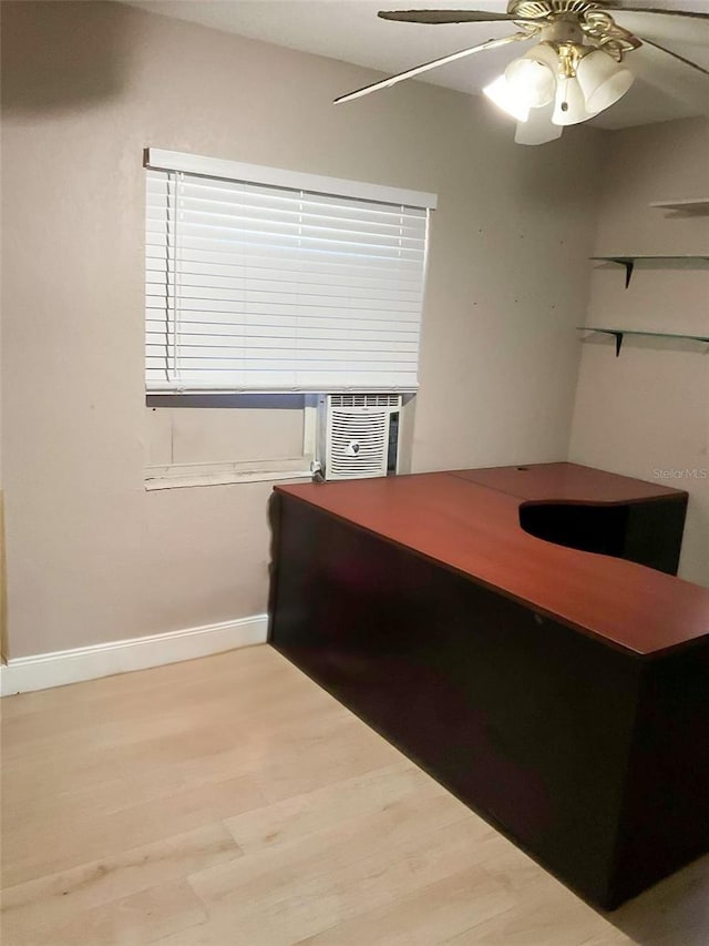 home office with ceiling fan, cooling unit, and light hardwood / wood-style floors