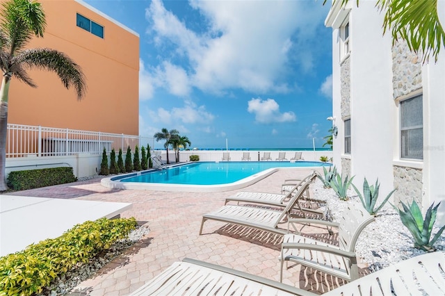 view of swimming pool featuring a patio