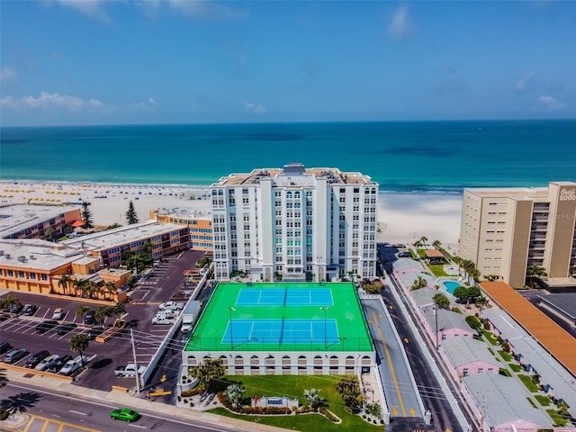 drone / aerial view with a water view and a view of the beach