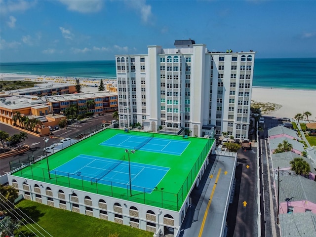 bird's eye view with a water view and a view of the beach