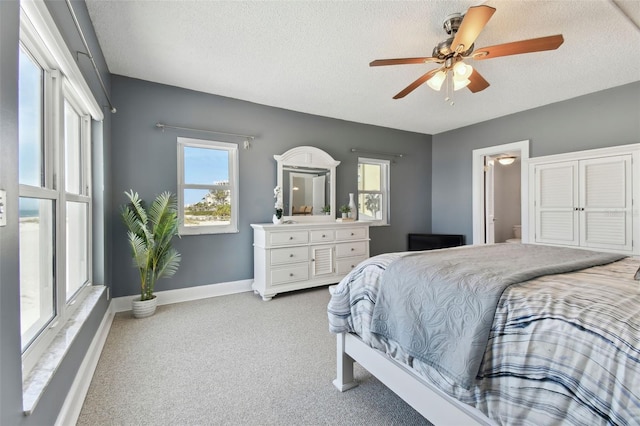 bedroom featuring a textured ceiling and ceiling fan