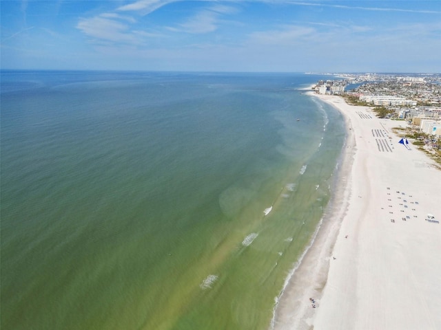 bird's eye view featuring a water view and a beach view