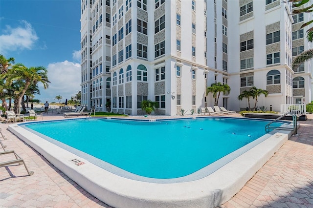 view of swimming pool with a patio