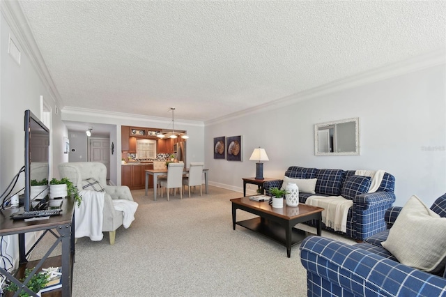 carpeted living area with baseboards, visible vents, ornamental molding, and a textured ceiling