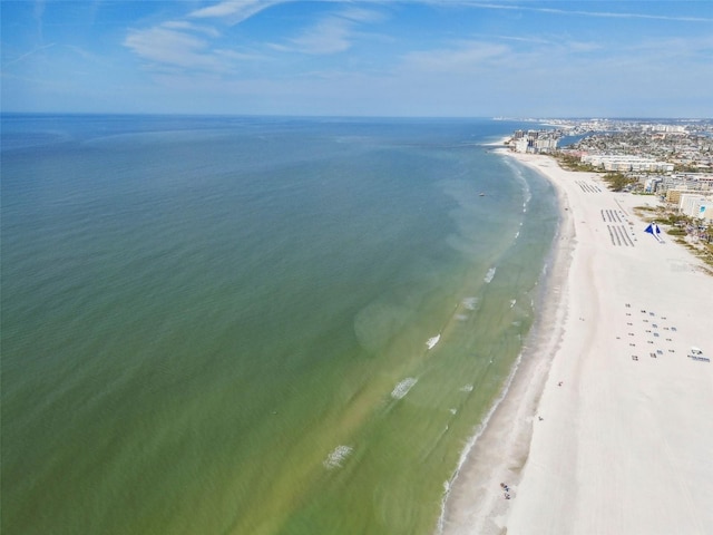 drone / aerial view with a water view and a view of the beach