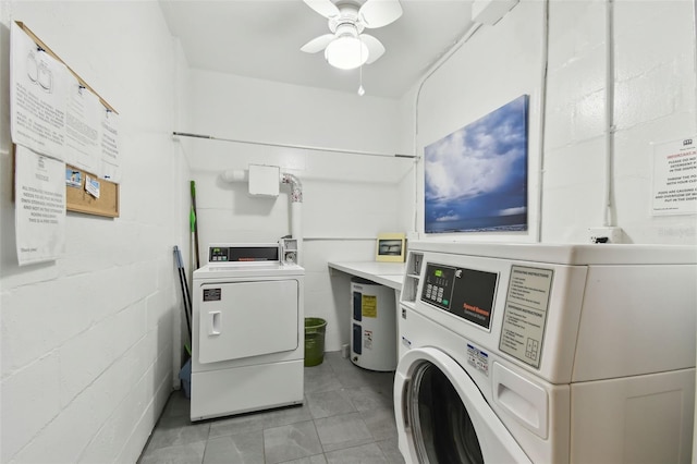common laundry area featuring washer and dryer, concrete block wall, water heater, a ceiling fan, and light tile patterned floors