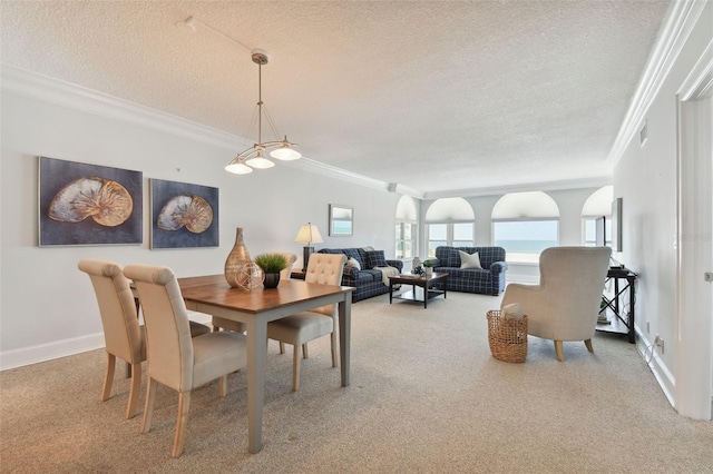 dining room featuring crown molding, a textured ceiling, visible vents, and carpet