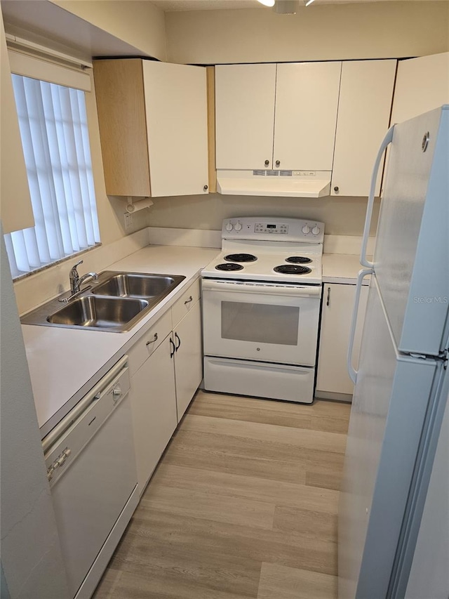 kitchen featuring white appliances, light hardwood / wood-style flooring, white cabinetry, and sink