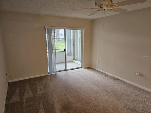 unfurnished room with a textured ceiling, light colored carpet, and ceiling fan