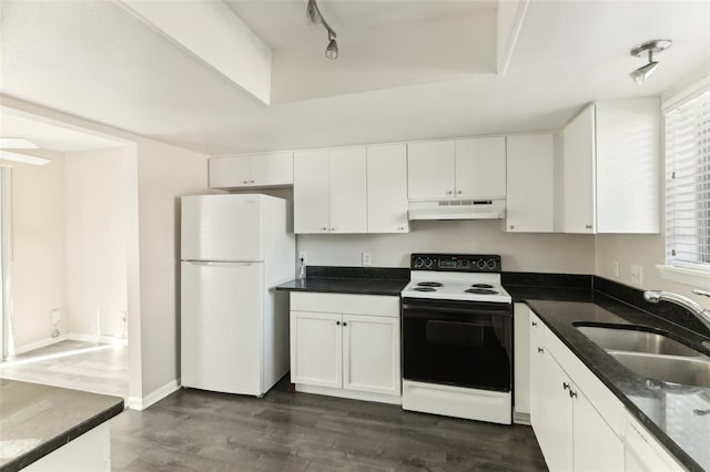 kitchen with rail lighting, white appliances, sink, dark hardwood / wood-style floors, and white cabinetry