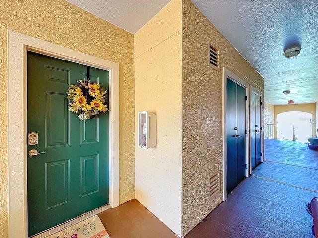 doorway to property with a porch