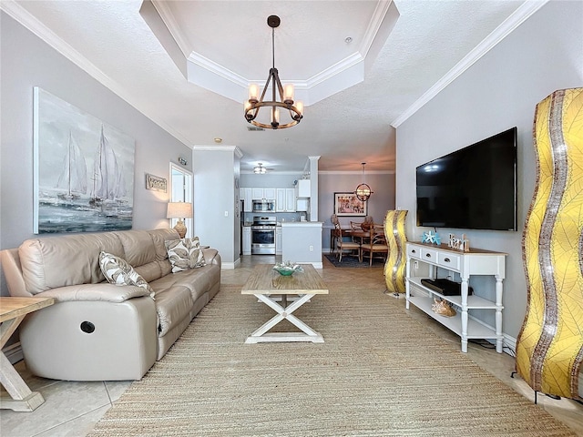 tiled living room with a textured ceiling, crown molding, and a notable chandelier