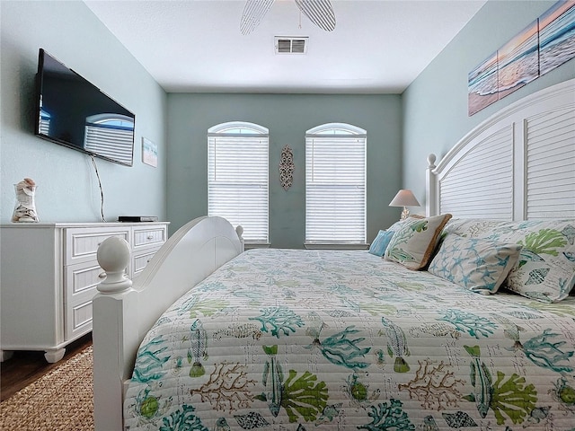 bedroom with hardwood / wood-style flooring and ceiling fan