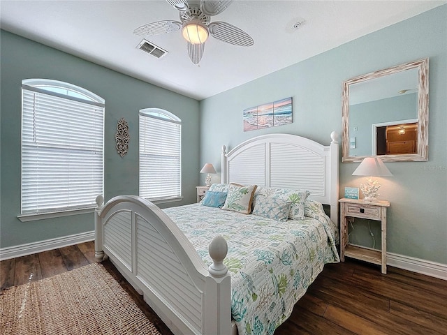 bedroom with ceiling fan and dark wood-type flooring