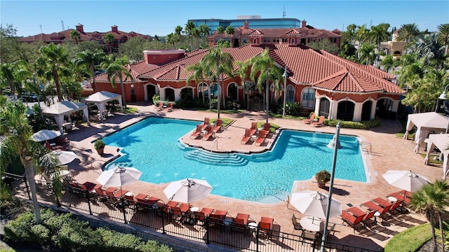 pool featuring a patio area and fence