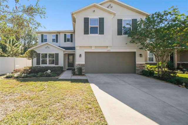 view of front of home featuring a garage and a front lawn