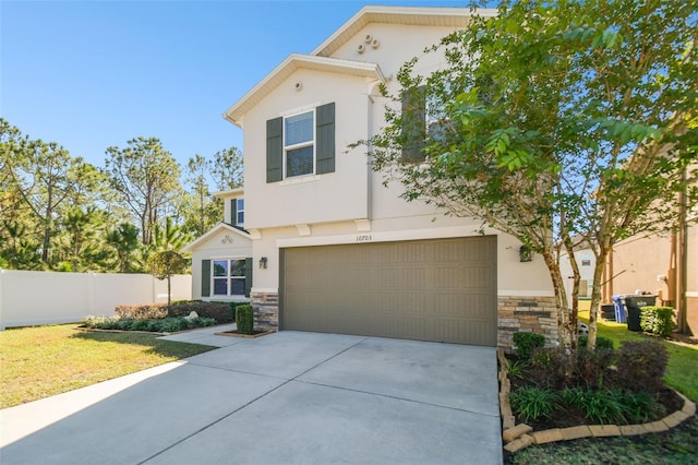 view of front of home featuring a garage and a front lawn