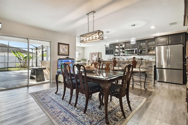 dining space featuring light hardwood / wood-style floors