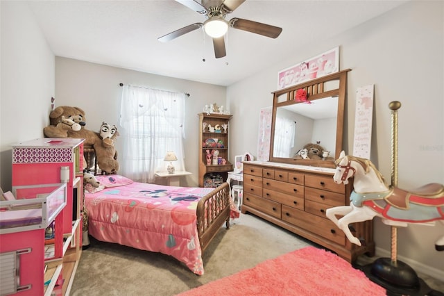 bedroom featuring light colored carpet and ceiling fan