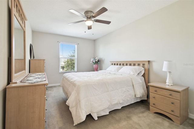 bedroom featuring dark carpet and ceiling fan