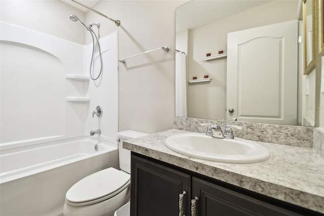 full bathroom with shower / washtub combination, vanity, and toilet