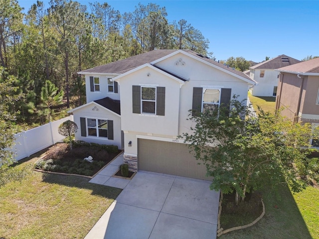 view of front of home featuring a garage and a front yard