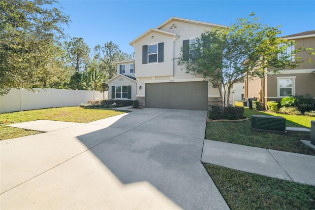 view of front facade featuring a garage and a front lawn