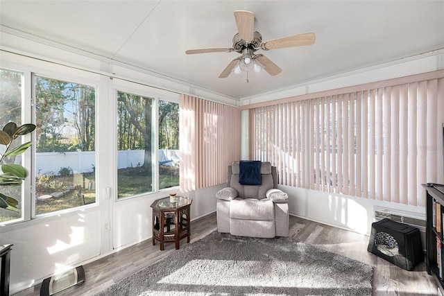 sunroom / solarium with ceiling fan