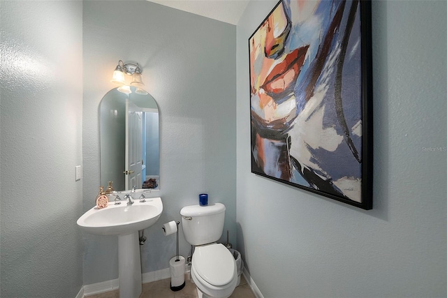 bathroom with sink and toilet