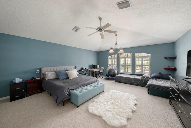 carpeted bedroom with a textured ceiling, vaulted ceiling, and ceiling fan