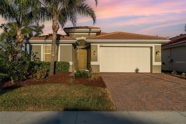 mediterranean / spanish-style house featuring a garage