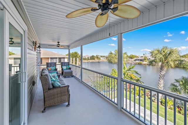 balcony featuring outdoor lounge area and a water view