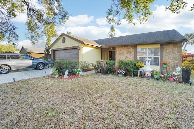 ranch-style home featuring a front lawn and a garage