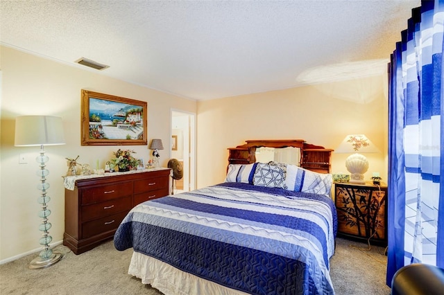 carpeted bedroom with a textured ceiling