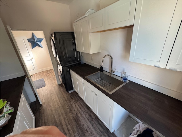 kitchen featuring white cabinets, sink, and dark wood-type flooring