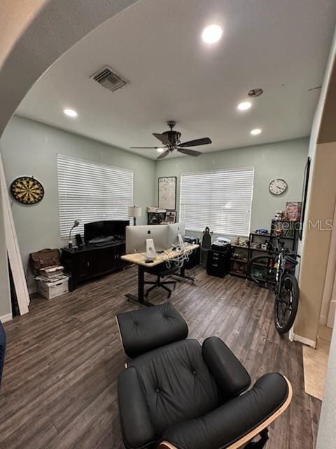 living room with dark hardwood / wood-style floors and ceiling fan