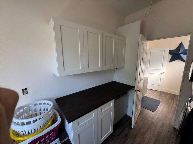 kitchen featuring white cabinets and dark hardwood / wood-style floors