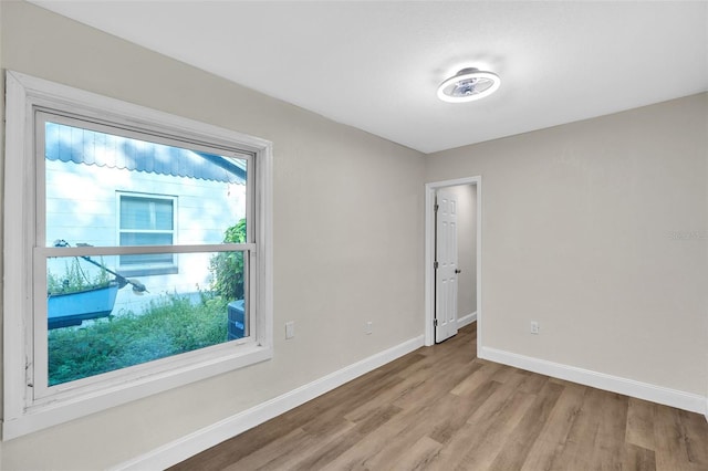 spare room featuring light hardwood / wood-style floors